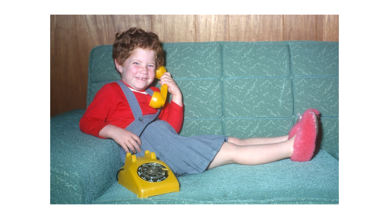 Young LInda J. Harris with rotary phone image