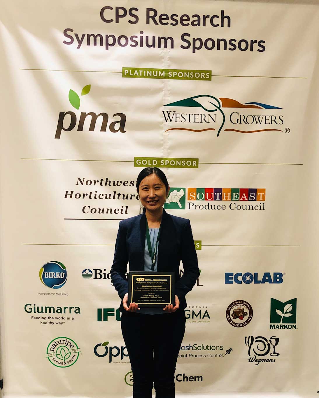 Dr. Wang with award