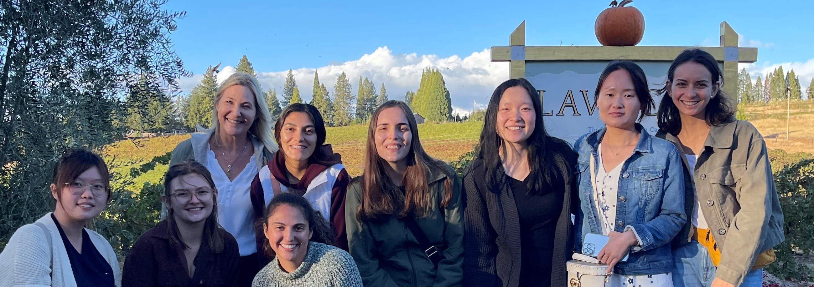 Alyson Mitchell lab group posing on Apple Hill field trip