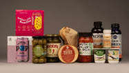 an array of probiotic containing products - kimchi, yogurt, olives, beverages