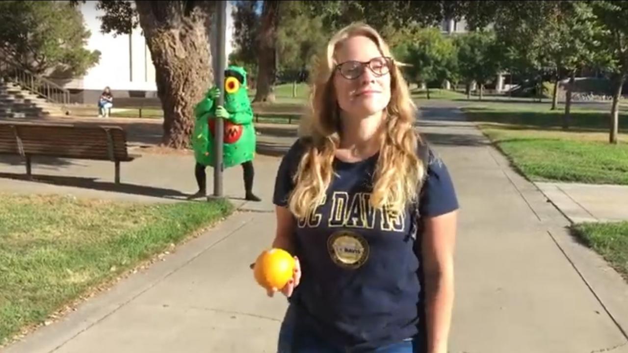 Video clip with student holding orange