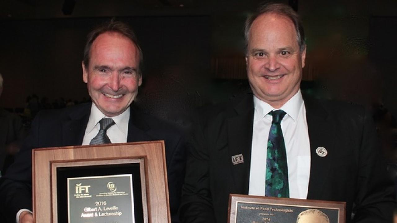 Bruce German and Carl Winter with their awards