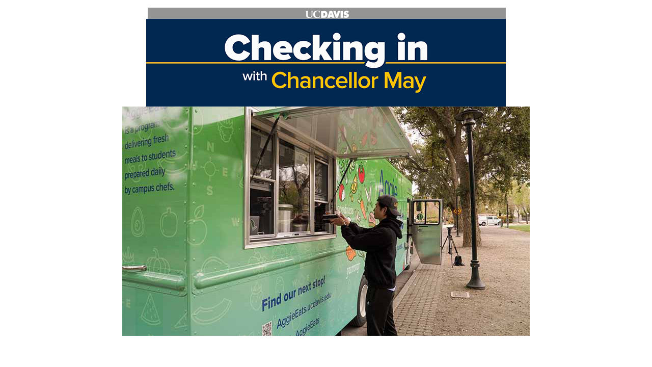 photo of student waiting for food at food truck