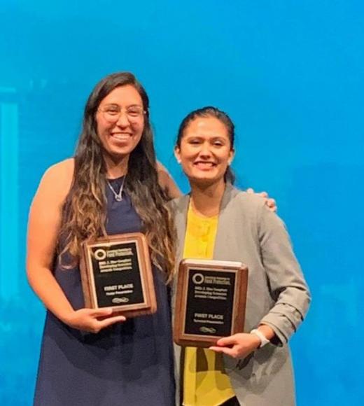 Erika, 1st place poster winner, and Karuna, 1st place technical winner