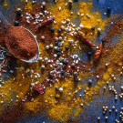 Image of spices spread out on counter - Getty
