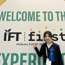 Xiran Li image with background of IFT event, July 2023