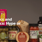 an array of probiotic foods including kimchi, pickles, olives, and beverages. 